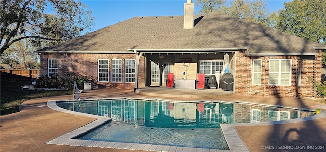 pool with a patio