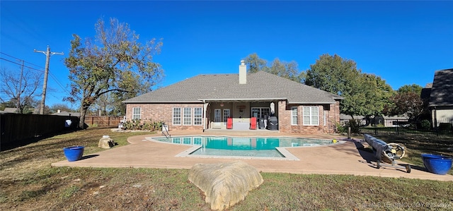 view of swimming pool featuring a fenced in pool, a fenced backyard, and a patio