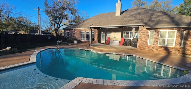 view of swimming pool featuring a patio