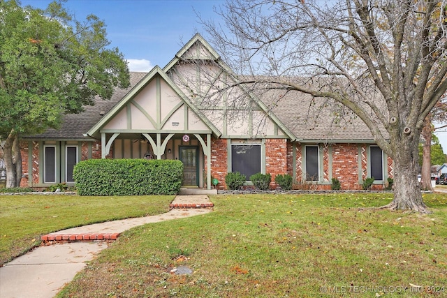 tudor house with a front lawn