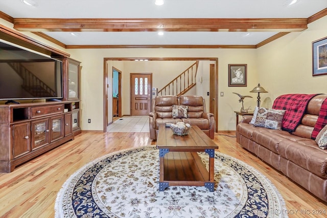 living room featuring beamed ceiling, crown molding, and light wood-type flooring