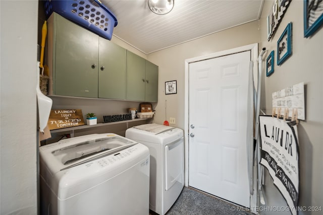 clothes washing area with cabinets and separate washer and dryer