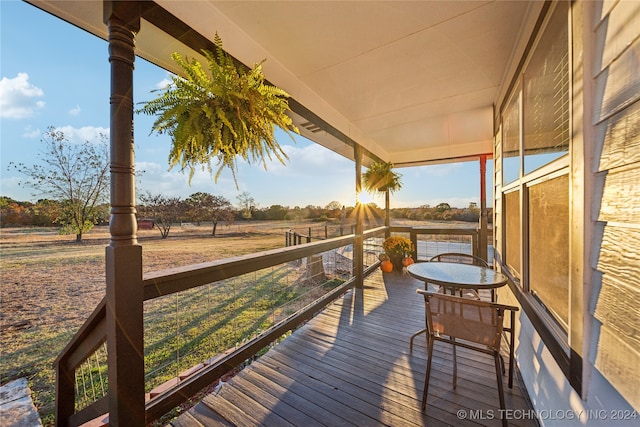 wooden terrace featuring a rural view