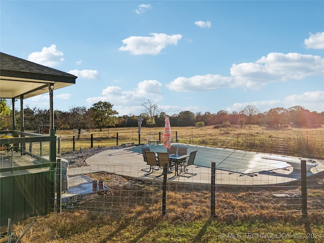 view of yard featuring a rural view and a patio area