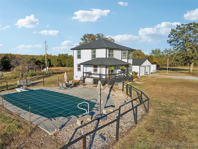 exterior space featuring a lawn, a covered pool, and a gazebo