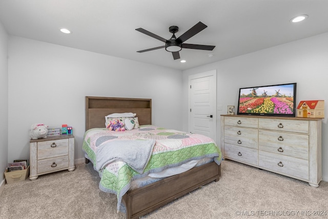 bedroom featuring ceiling fan and carpet