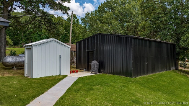 view of outdoor structure with a lawn