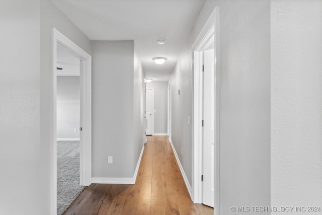 hall with light wood-type flooring