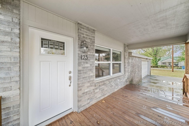 doorway to property with a garage