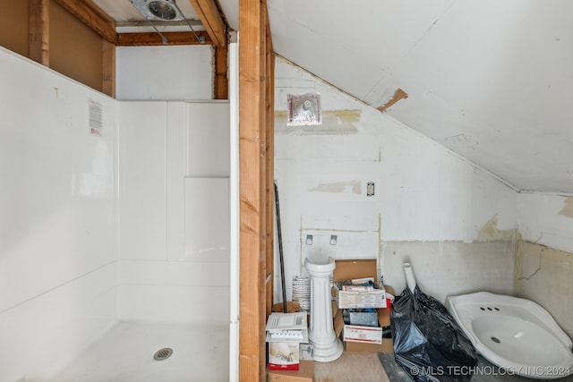 bathroom with vaulted ceiling