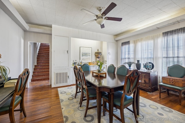 dining room featuring dark hardwood / wood-style flooring and ceiling fan