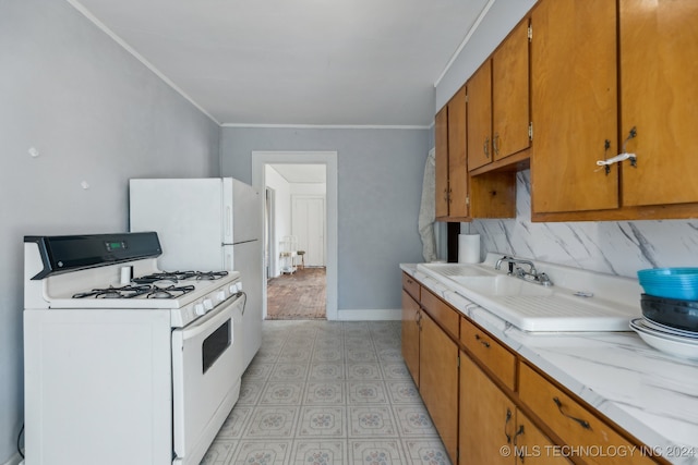 kitchen featuring decorative backsplash, white range with gas stovetop, and ornamental molding