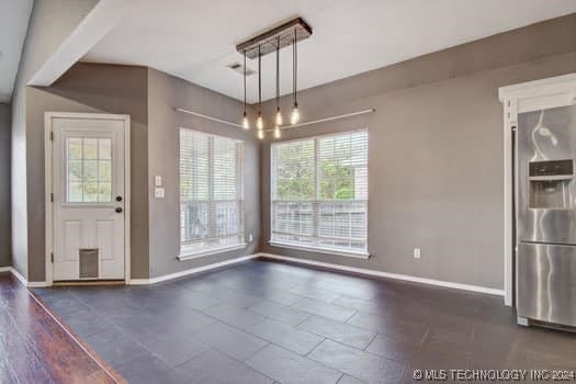 unfurnished dining area with a wealth of natural light