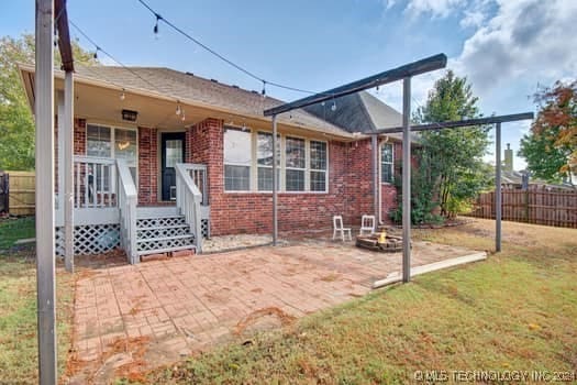 rear view of house with a patio