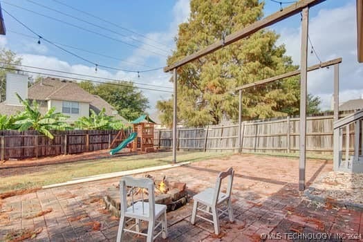 view of patio featuring a playground