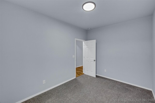 spare room featuring carpet floors