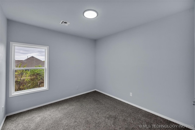 unfurnished room featuring carpet