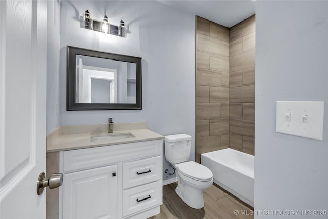 full bathroom with vanity, toilet, and tiled shower / bath