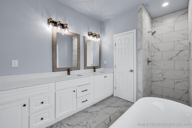 bathroom featuring vanity and shower with separate bathtub