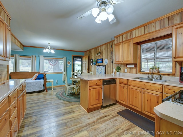 kitchen with kitchen peninsula, stainless steel dishwasher, ceiling fan with notable chandelier, crown molding, and sink