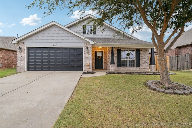 view of front facade with a front lawn and a garage