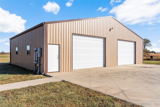 garage with a lawn