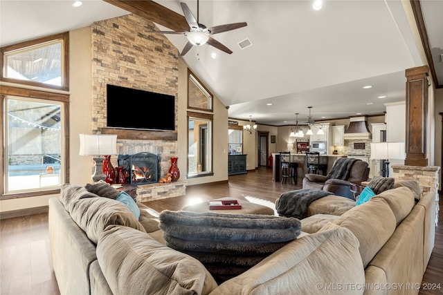 living room featuring high vaulted ceiling, a healthy amount of sunlight, and dark hardwood / wood-style floors