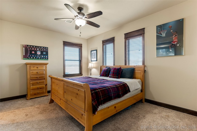 bedroom featuring light carpet and ceiling fan