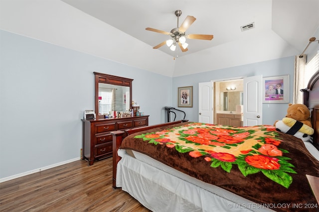 bedroom featuring connected bathroom, ceiling fan, wood-type flooring, and vaulted ceiling