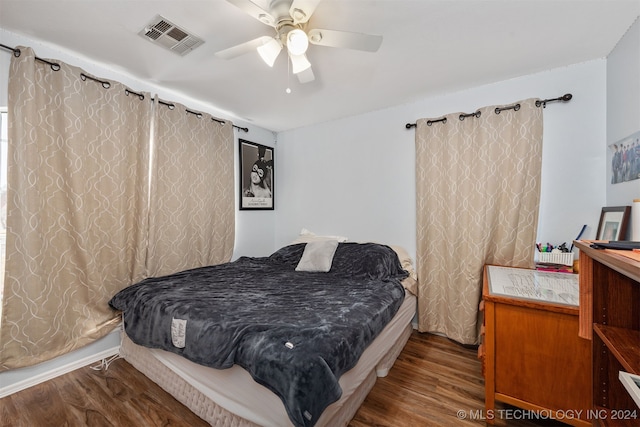 bedroom with ceiling fan and hardwood / wood-style floors