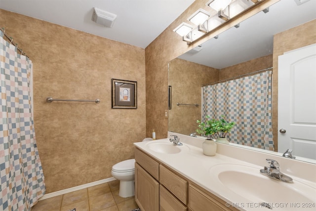 bathroom with toilet, a shower with curtain, vanity, and tile patterned floors