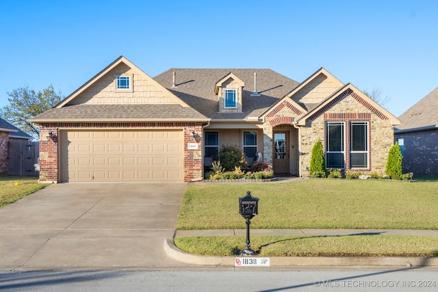 craftsman-style home with a garage and a front yard