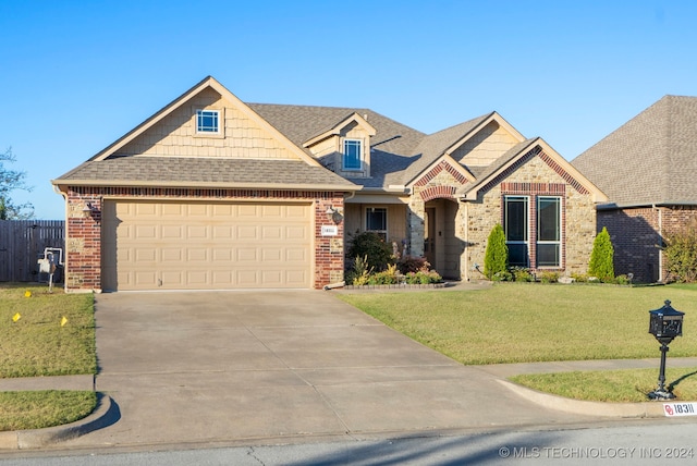 view of front of house featuring a garage and a front lawn