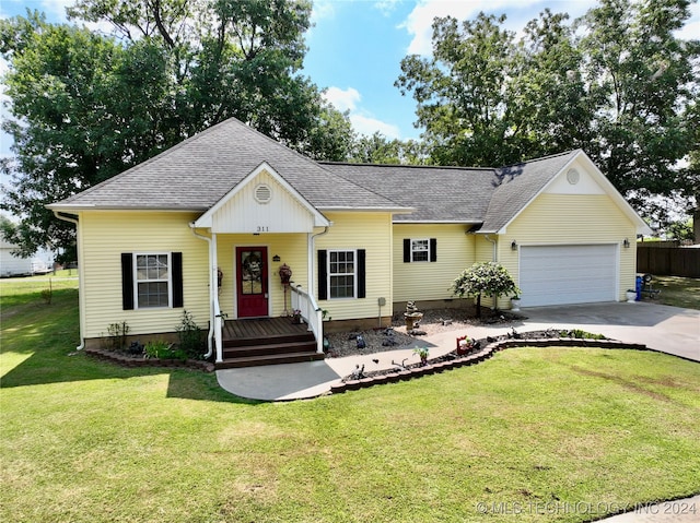 ranch-style home featuring a garage and a front lawn