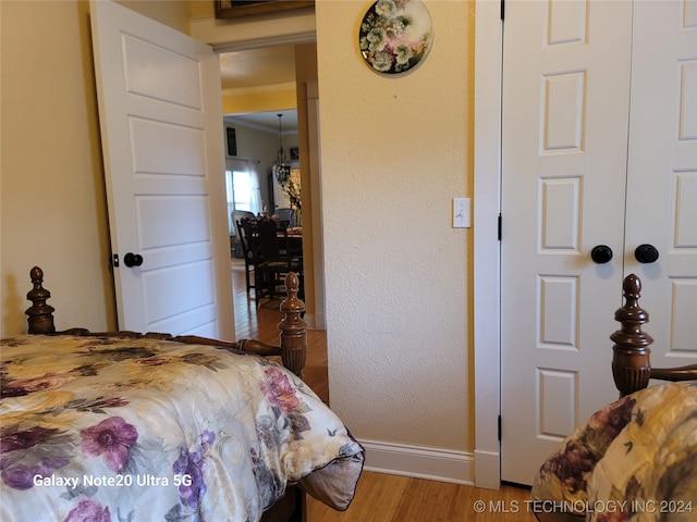 bedroom with hardwood / wood-style floors