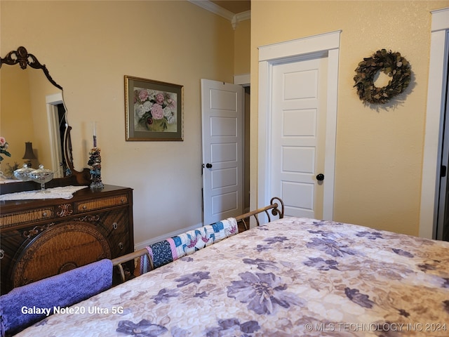 bedroom with crown molding