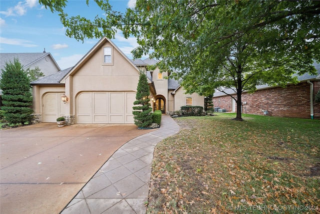 view of front facade with a garage and a front yard