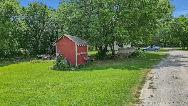 view of outbuilding with a lawn