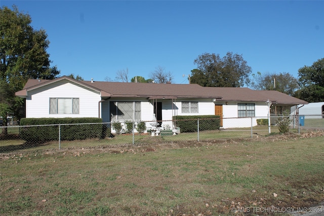 ranch-style house with a front lawn