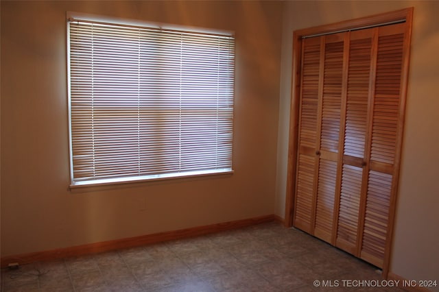 unfurnished bedroom with a closet