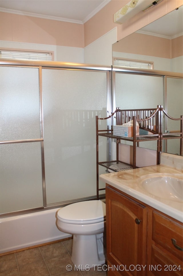 full bathroom featuring tile patterned floors, vanity, enclosed tub / shower combo, and ornamental molding