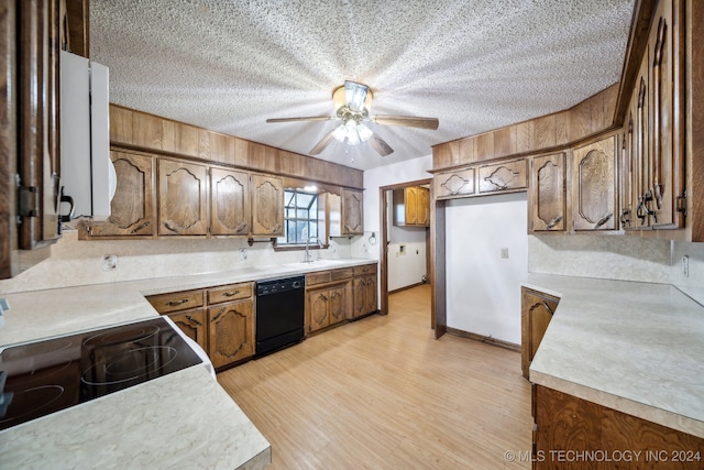 kitchen with range, sink, light hardwood / wood-style floors, dishwasher, and ceiling fan