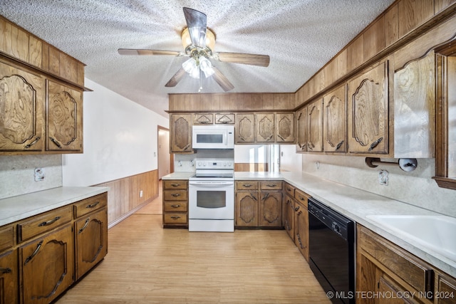 kitchen with light wood-type flooring, a textured ceiling, white appliances, and ceiling fan