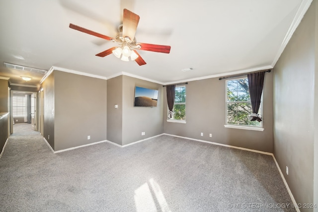 carpeted empty room with ceiling fan and ornamental molding