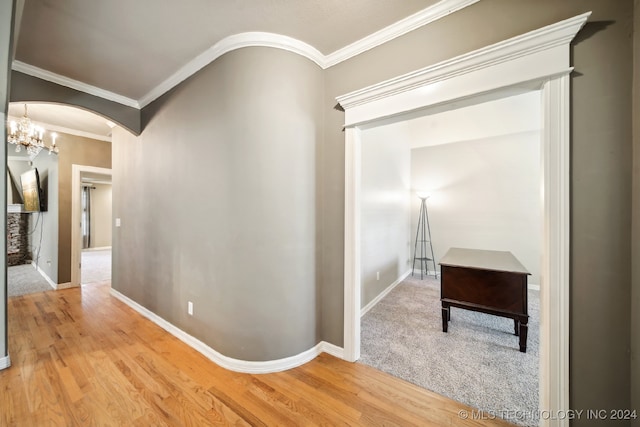 hall featuring ornamental molding and hardwood / wood-style floors