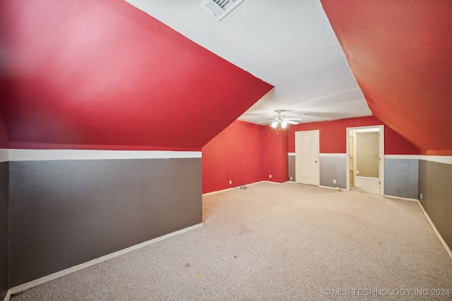 bonus room with ceiling fan, lofted ceiling, and carpet floors