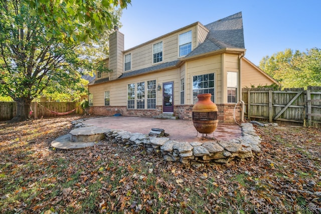 rear view of house with a patio