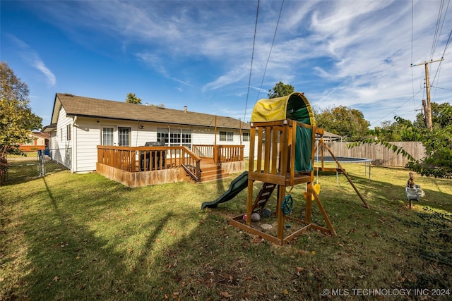 view of jungle gym featuring a deck and a yard