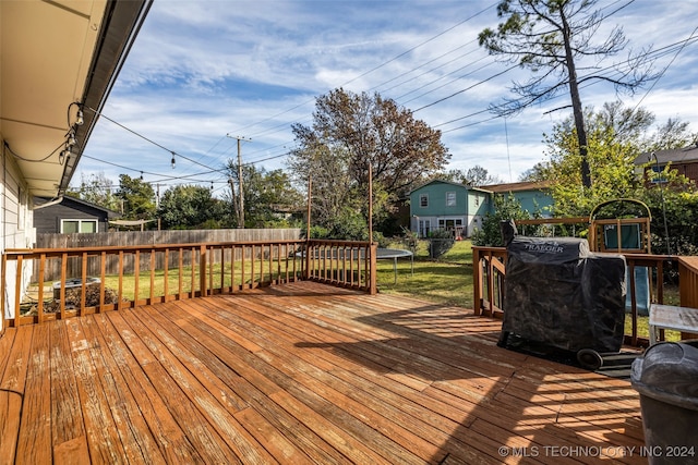 wooden deck with area for grilling