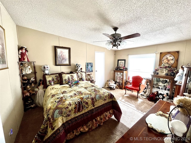 bedroom featuring a textured ceiling, carpet flooring, and ceiling fan